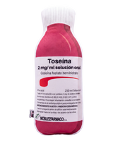 Toseina Pillow front view - plush medicine bottle cushion with Spanish label, pink and white, NOBLEZFARMACO