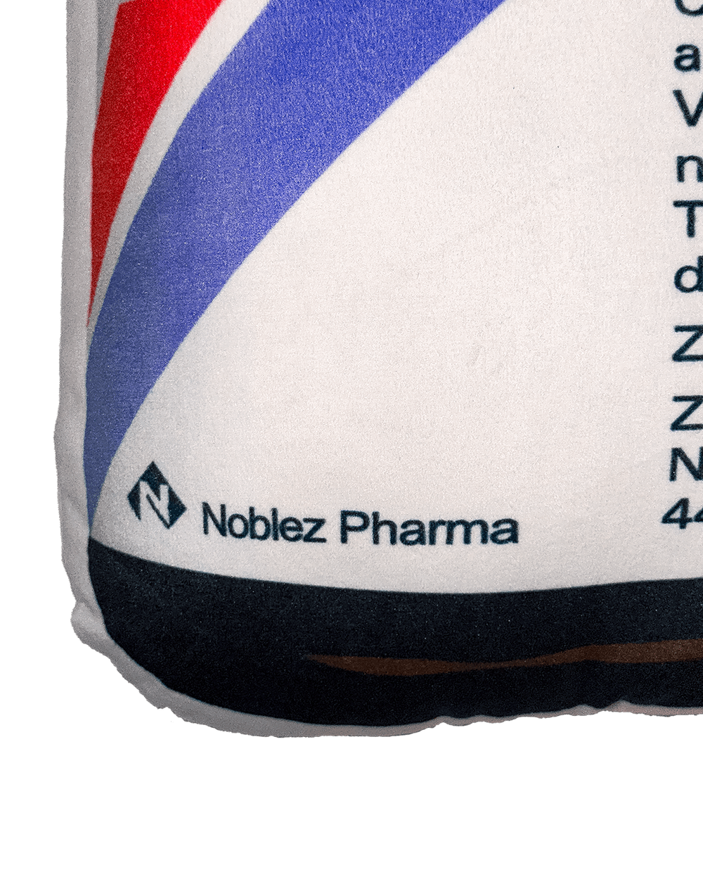 Noblez Pharma medicine bottle pillow label detail red blue stripe pharmaceutical branding cushion merchandise closeup
